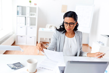 Image showing businesswoman with laptop working at office