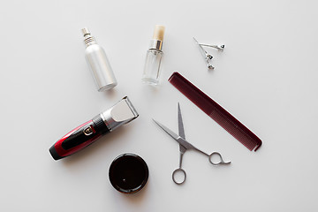 Image showing styling hair spray, trimmer and scissors