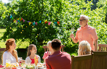 Image showing happy family having dinner or summer garden party