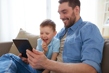 Image showing father and son with tablet pc playing at home