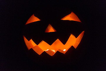 Image showing halloween jack-o-lantern burning in darkness