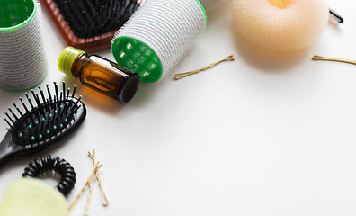 Image showing hair brushes, oil, curlers and pins