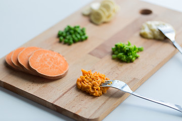 Image showing mashed fruits and vegetables with forks on board