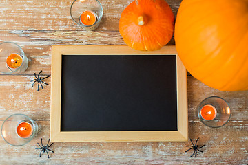 Image showing blank chalkboard and halloween decorations