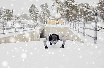 Image showing couple doing push-ups outdoors