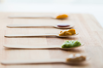 Image showing vegetable or fruit puree or baby food in spoons