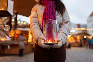 Image showing woman with candle in lantern at christmas market