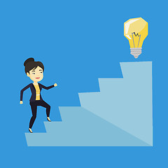 Image showing Business woman walking upstairs to the idea bulb.