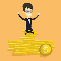 Image showing Happy business man sitting on golden coins.