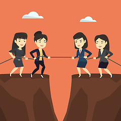 Image showing Two groups of business people pulling rope.