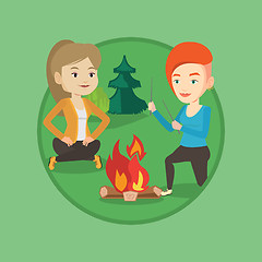 Image showing Two friends sitting around bonfire in camping.