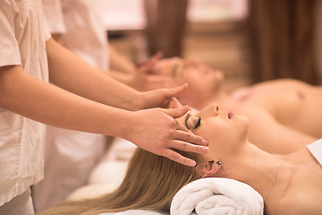 Image showing couple enjoying head massage at the spa