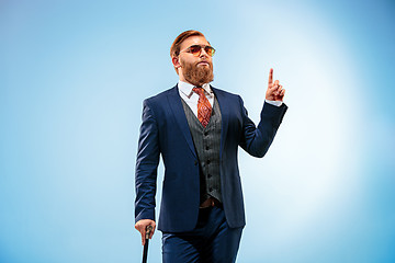 Image showing The barded man in a suit holding cane.