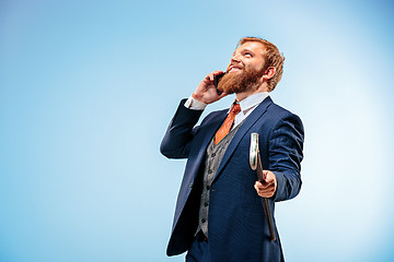 Image showing The barded man in a suit holding cane.