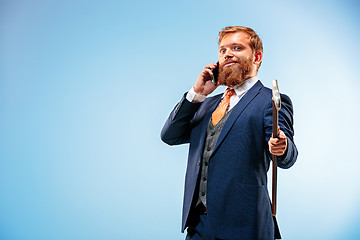 Image showing The barded man in a suit holding cane.