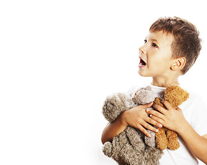 Image showing little cute boy with many teddy bears hugging isolated close up