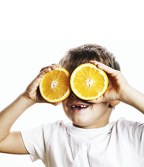 Image showing little cute boy with orange fruit double isolated on white smili