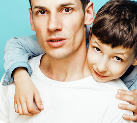 Image showing young pretty man model with little cute son playing together, lifestyle modern people concept, family male