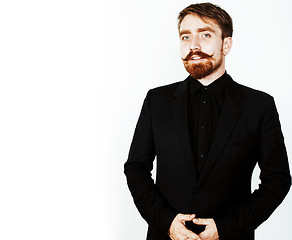 Image showing young red hair man with beard and mustache in black suit on whit