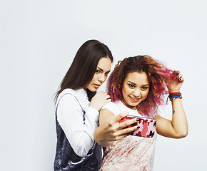 Image showing best friends teenage girls together having fun, posing emotional isolated white background, besties happy smiling, lifestyle people concept close up. making selfie