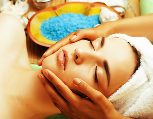 Image showing stock photo attractive lady getting spa treatment in salon, close up asian hands on face