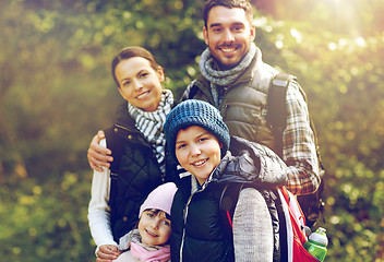 Image showing happy family with backpacks hiking