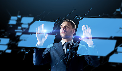 Image showing businessman working with virtual screen