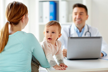 Image showing woman with baby and doctor with laptop at clinic