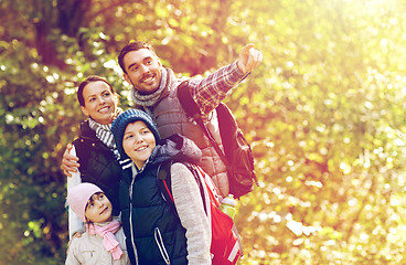 Image showing happy family with backpacks hiking