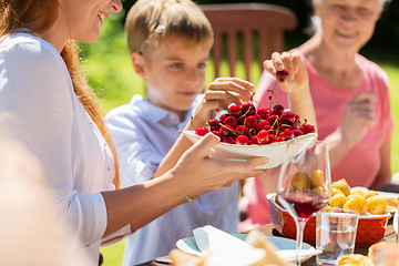 Image showing happy family having dinner or summer garden party