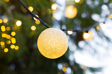 Image showing close up of christmas tree garland bulb outdoors