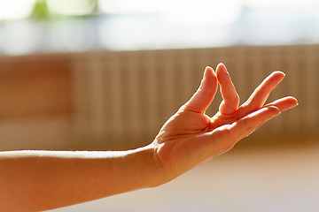 Image showing hand of meditating yogi woman showing gyan mudra