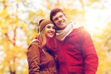 Image showing happy young couple walking in autumn park