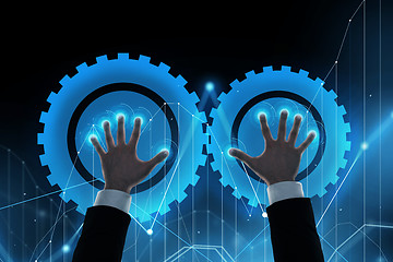 Image showing businessman hands with virtual cogwheels