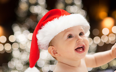 Image showing close up of little baby in santa hat at christmas
