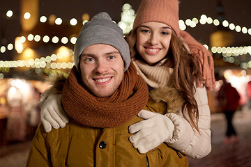 Image showing happy couple hugging at christmas tree