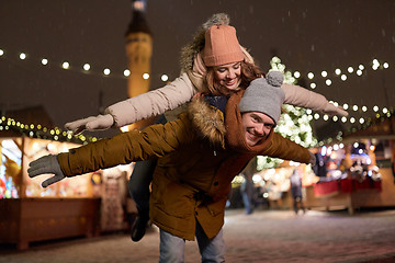 Image showing happy couple having fun at christmas market