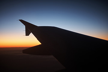 Image showing Seeing the sunset on flight