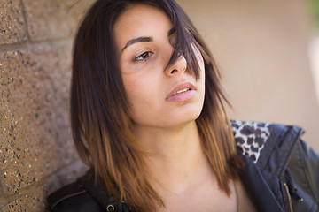 Image showing Beautiful Meloncholy Mixed Race Young Woman Portrait Outside.