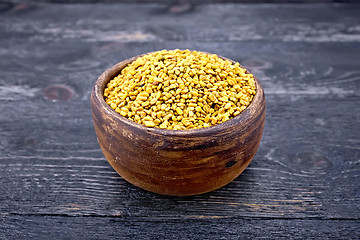 Image showing Fenugreek in clay bowl on black board