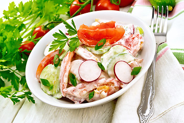 Image showing Salad from fresh vegetables with greens in plate on board