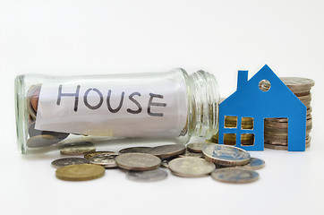 Image showing House model and stacks of coins