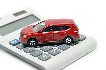 Image showing Calculator and red toy car