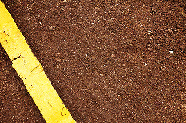 Image showing Black road pavement with yellow line