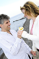 Image showing Mature romantic couple with flowers