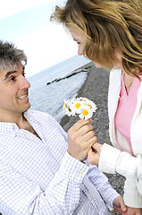 Image showing Mature romantic couple with flowers