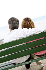 Image showing Mature romantic couple on a bench