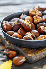 Image showing Roast chestnuts in a pan closeup.