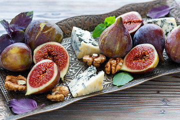 Image showing Blue cheese and ripe figs on a bronze tray.