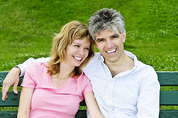 Image showing Mature romantic couple on a bench